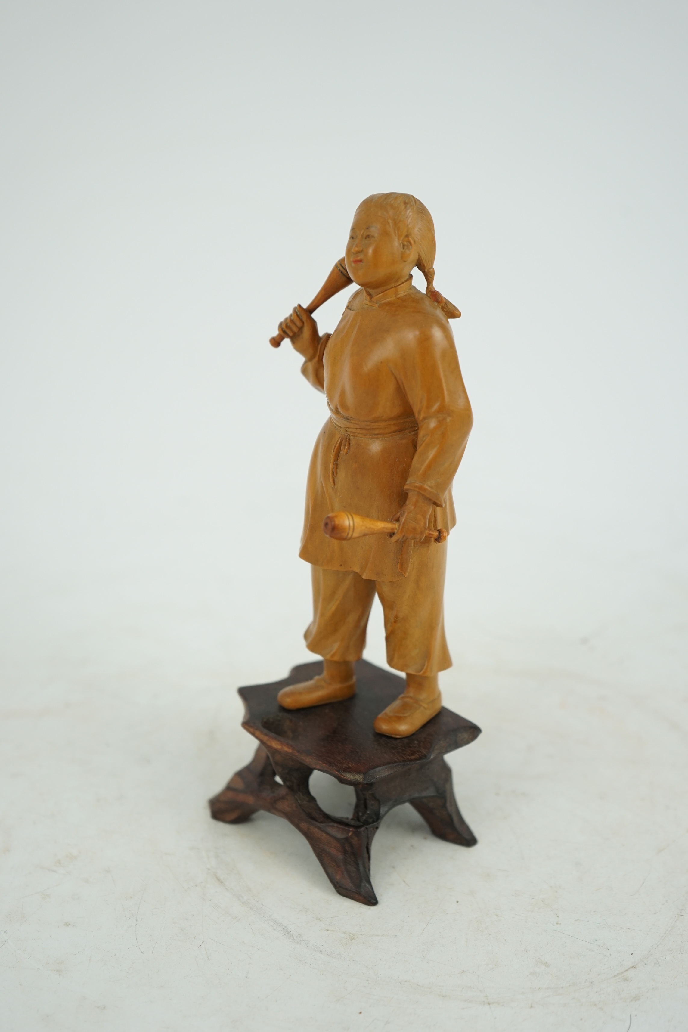 A Chinese boxwood figure of a female juggler, attributed to Zhu Zichang (1876-1934), Republic period